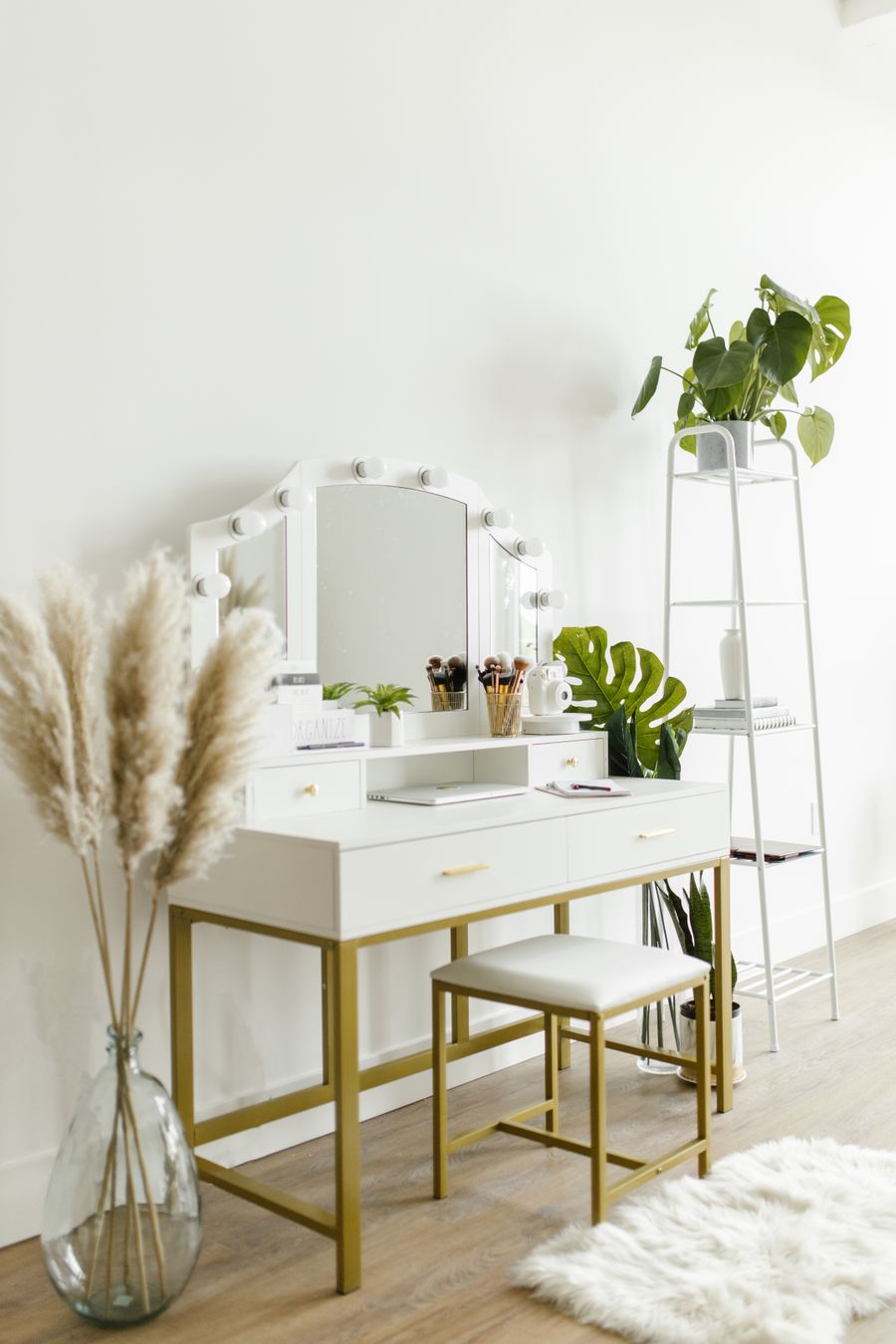 White dressing table with a mirror and a stool